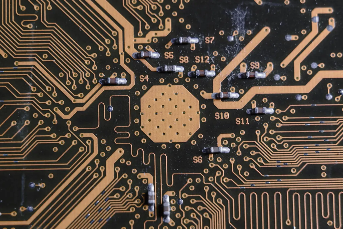 Close-up of a printed circuit board showing its electronic pathways and components